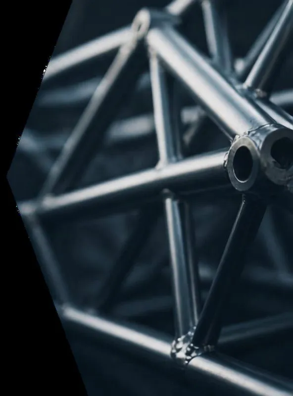 Close-up of an aluminium exhibition truss structure in dark grey tones